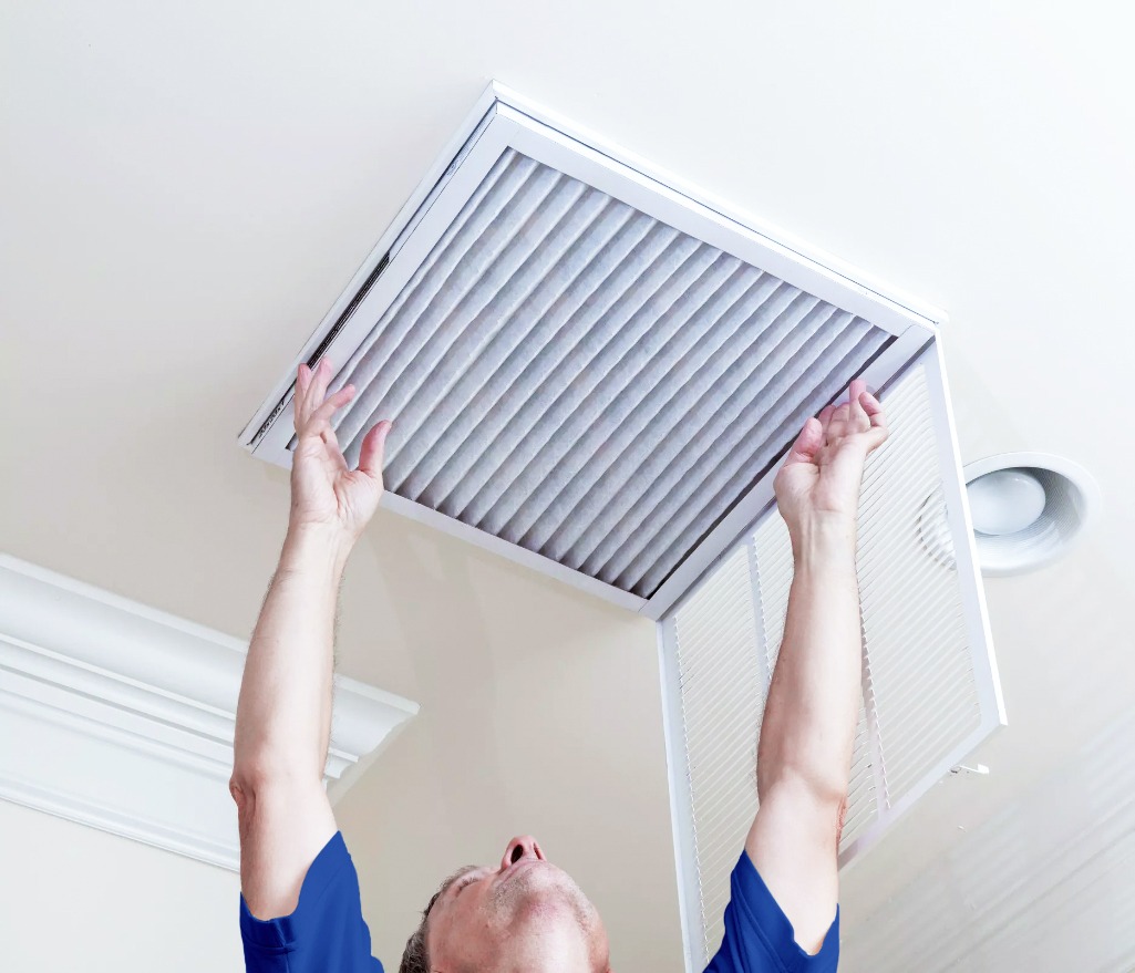 Man Cleaning Filter